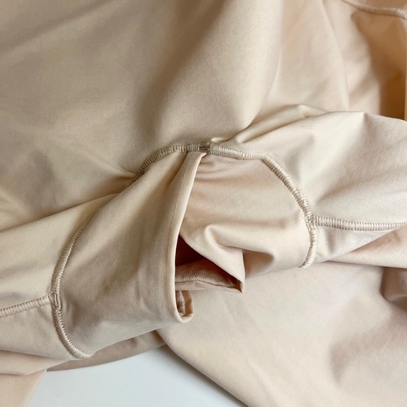 SPANX Thinstincts 2.0 Open-Bust Mid-Thigh
Bodysuit in Nude - Picture 9 of 13